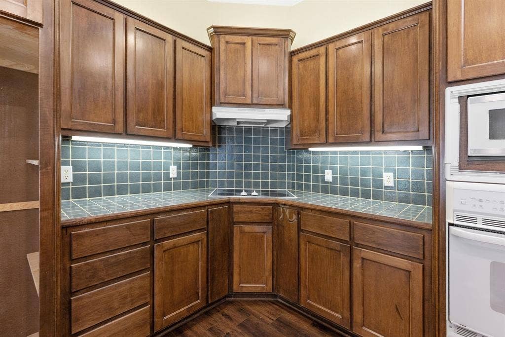 1200 County Road 2307, Sulphur Springs, TX 75482 Kitchen has good work triangle, lots of storage, custom wood cabinets.