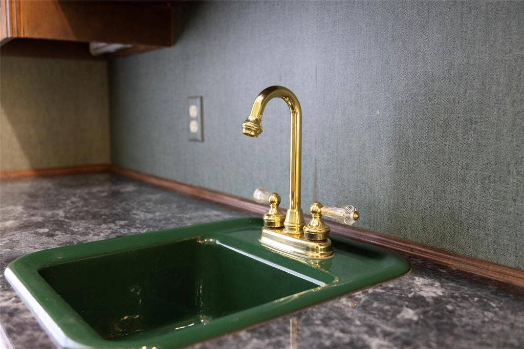 1200 County Road 2307, Sulphur Springs, TX 75482 Wet bar sink; lots of natural wood cabinets and trim in this home
