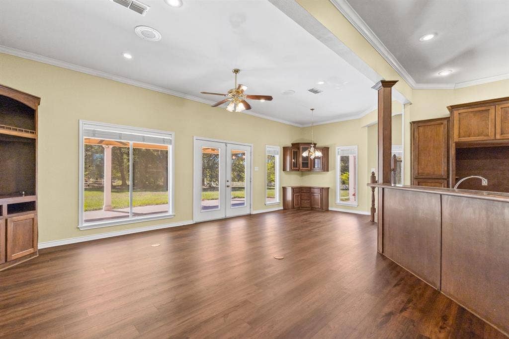 1200 County Road 2307, Sulphur Springs, TX 75482 Great room is next to the kitchen, includes a breakfast nook with built-in cabinets. Kitchen island has breakfast bar