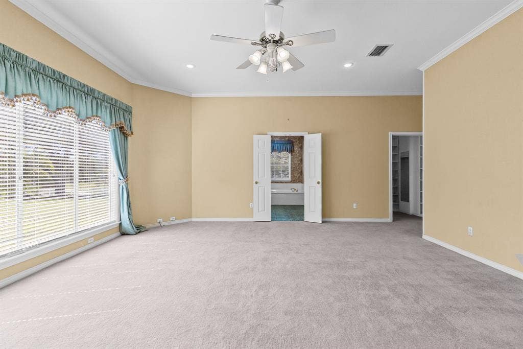 1200 County Road 2307, Sulphur Springs, TX 75482 Primary bedroom is oversized, with huge walk-in closet and ensuite bath with separate vanities.
