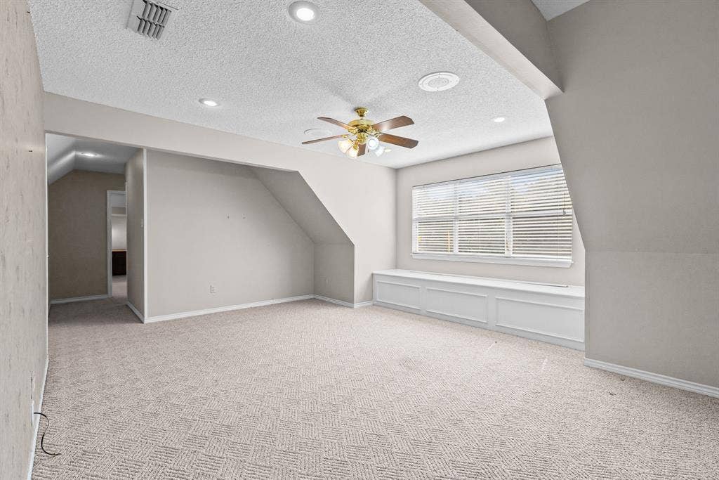1200 County Road 2307, Sulphur Springs, TX 75482 Upstairs, there is a large bonus or game room, with window seat with storage. Hall leads back to two hidden bedrooms and a shared bath.