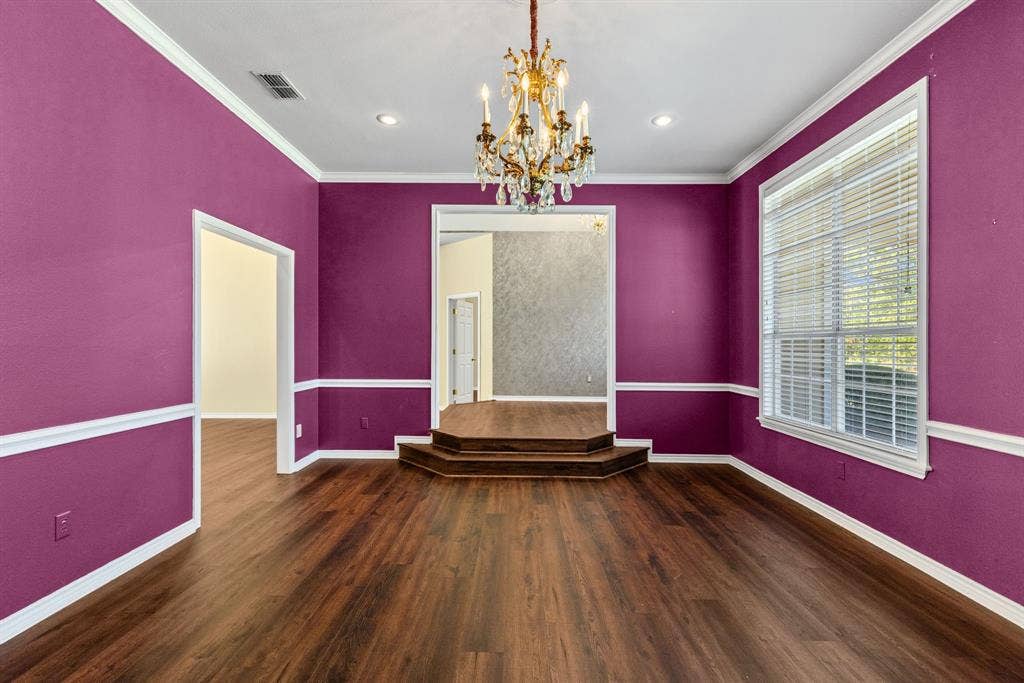 1200 County Road 2307, Sulphur Springs, TX 75482 Formal dining room is large, with chandelier and windows overlooking the front landscaping.