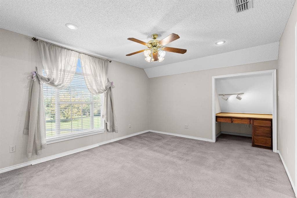 1200 County Road 2307, Sulphur Springs, TX 75482 Bedroom 2 is one of the two bedrooms tucked behind the game room; has built-in desk with lighting.