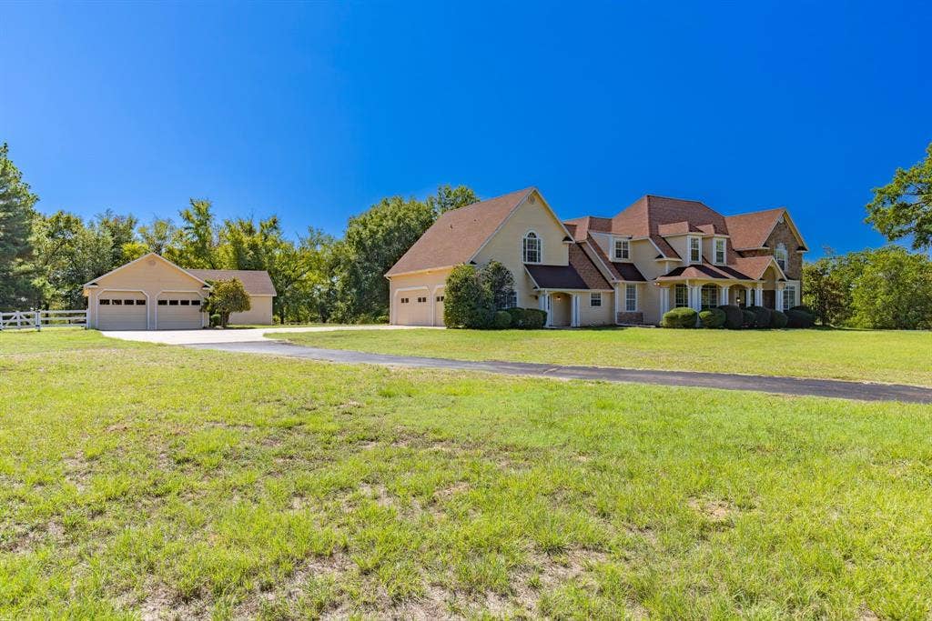 1200 County Road 2307, Sulphur Springs, TX 75482 View of driveway, house and workshop from front pasture- all on a hilltop!