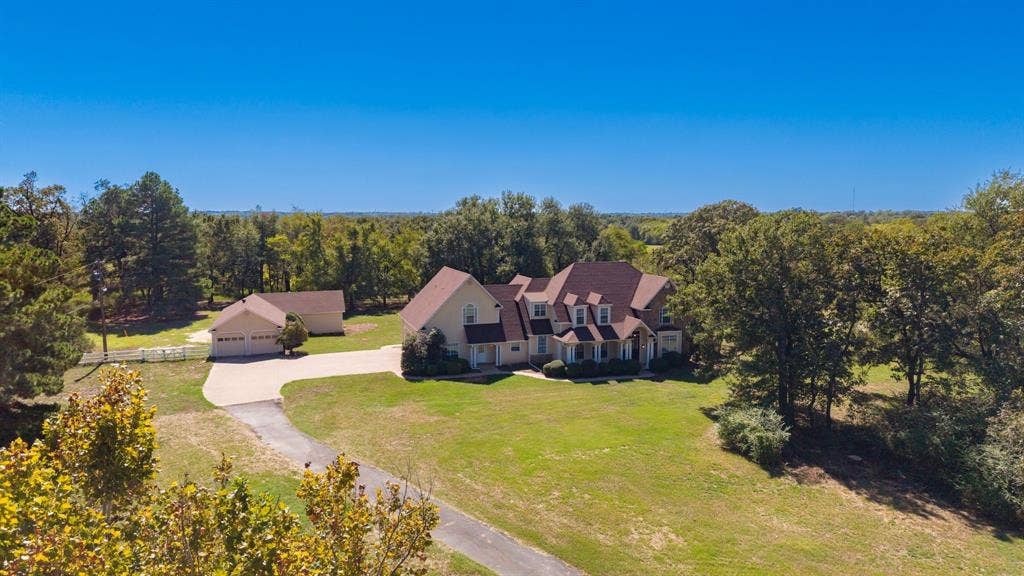 1200 County Road 2307, Sulphur Springs, TX 75482 Drone view of house and grounds.