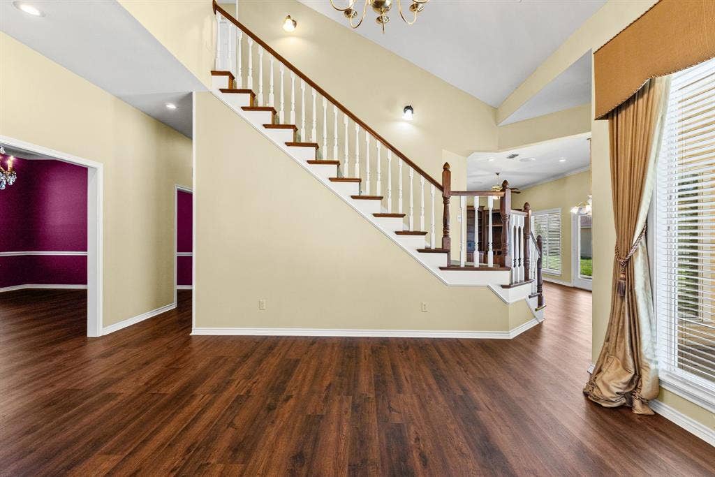 1200 County Road 2307, Sulphur Springs, TX 75482 Living room has very high ceilings, gorgeous window treatments, overlooks the back yard.