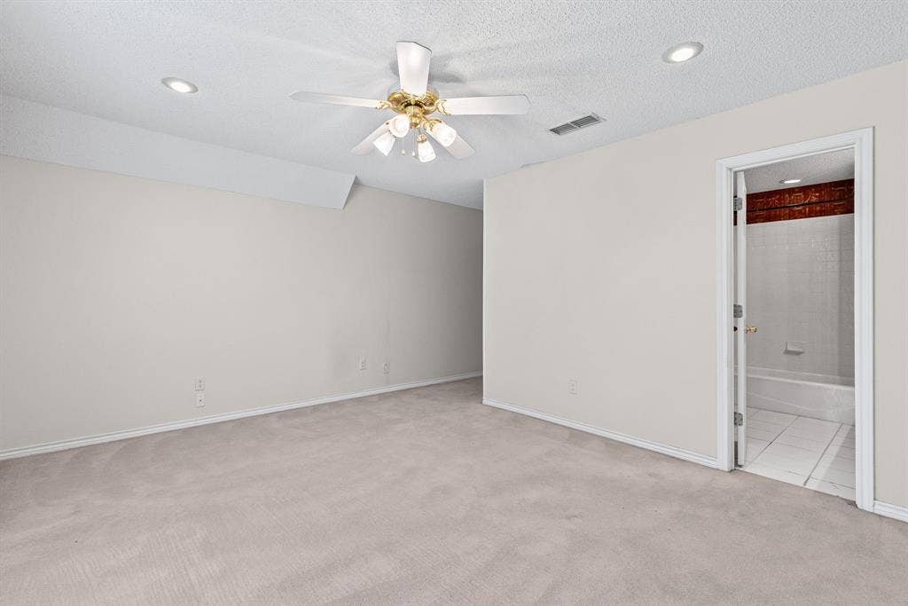 1200 County Road 2307, Sulphur Springs, TX 75482 Bedroom 5 is private at the far end of the upstairs hall, with double windows, ensuite bath and WIC.