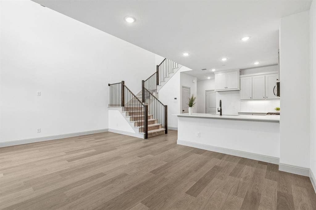 1025 Splitrock Drive, Allen, TX 75013 Metal railing on your new staircase continues the open and airy feeling upstairs.