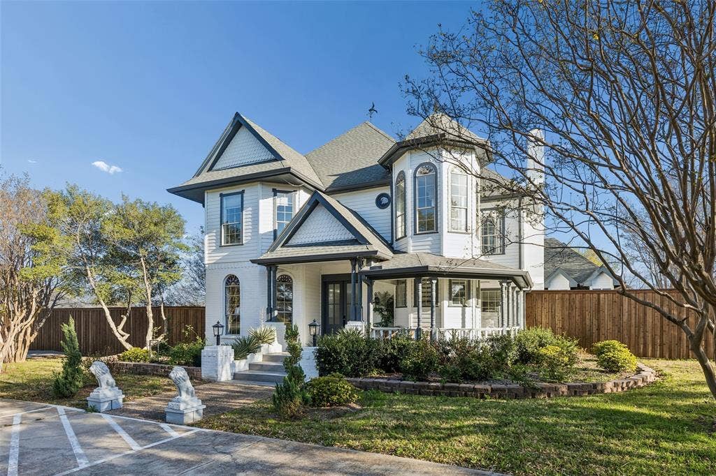 3706 Castle Drive, Rowlett, TX 75089 Victorian-style exterior with white siding and dark trim, featuring a prominent turret and a covered front porch