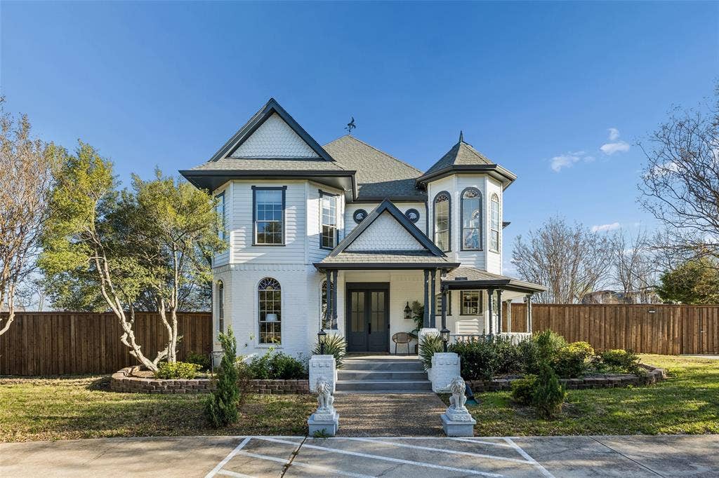 3706 Castle Drive, Rowlett, TX 75089 Victorian-style exterior with a turret, covered porch, multiple gables, and a fenced yard