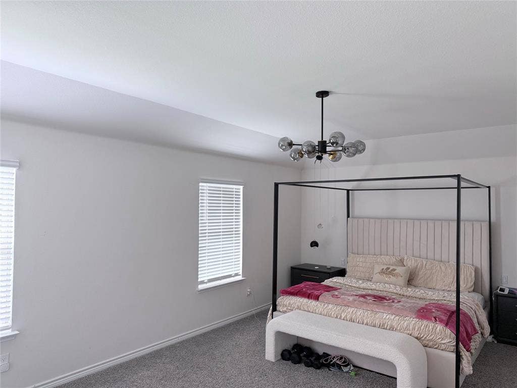 1602 Maple Ridge Drive, Princeton, TX 75407 Recessed ceiling, dual windows with blinds, and a contemporary chandelier