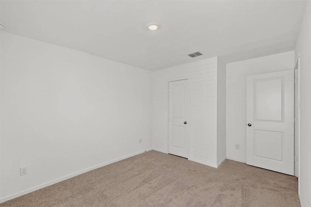 624 Kinglet Lane, Princeton, TX 75407 Plush carpet flooring, recessed ceiling lighting, and crisp white walls