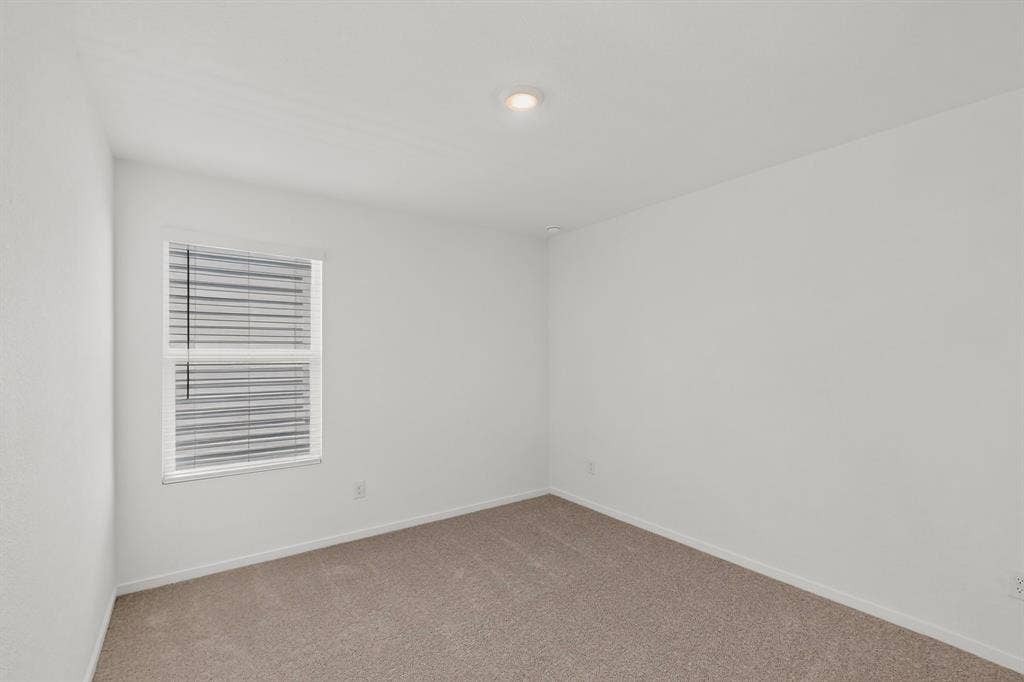 624 Kinglet Lane, Princeton, TX 75407 Recessed ceiling lighting, neutral carpet flooring, and window with horizontal blinds