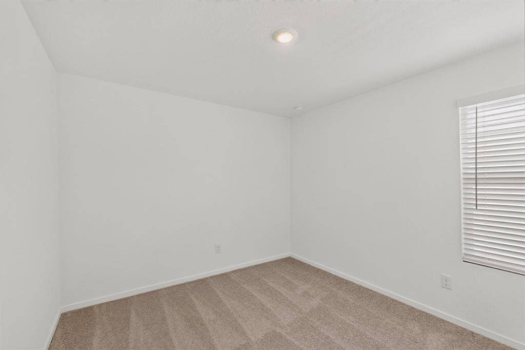 624 Kinglet Lane, Princeton, TX 75407 Recessed ceiling lighting, window with blinds, and neutral carpeting