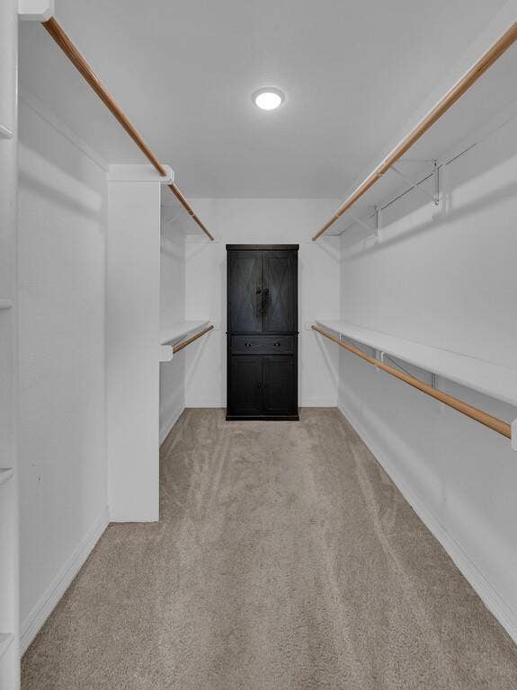 279 Sportsman Drive, Lorena, TX 76655 Built-in shelving and hanging rods, recessed ceiling light, and neutral-tone carpeting