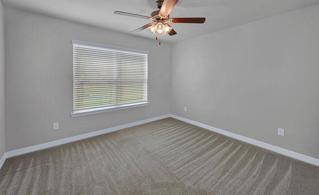 279 Sportsman Drive, Lorena, TX 76655 Window with blinds, ceiling fan, and light-colored carpeting