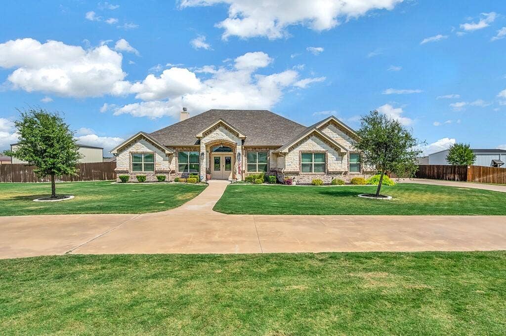 279 Sportsman Drive, Lorena, TX 76655 Stone and brick facade with a prominent arched entry