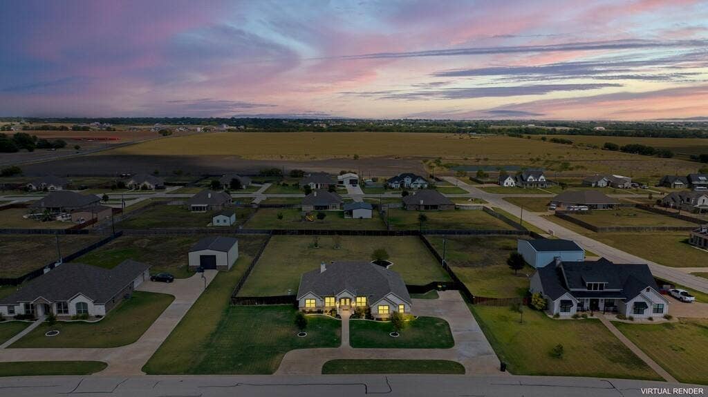 279 Sportsman Drive, Lorena, TX 76655 Aerial overview of a residential neighborhood with single-story homes and a large surrounding field