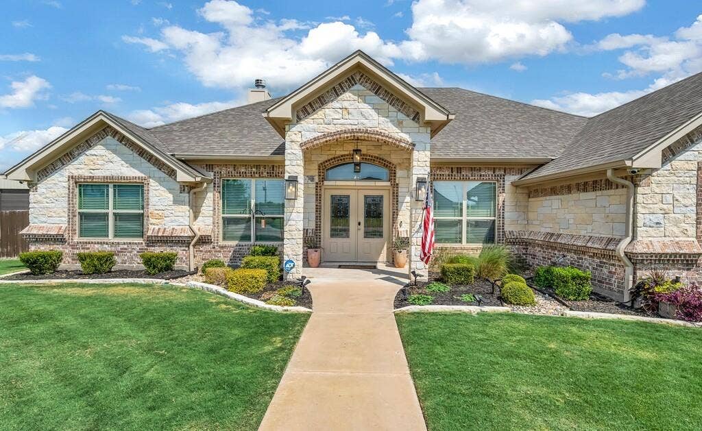 279 Sportsman Drive, Lorena, TX 76655 Stone and brick exterior with a gabled roofline