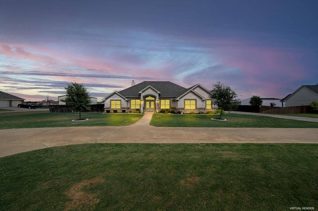 279 Sportsman Drive, Lorena, TX 76655 Exterior featuring stone and siding, a covered entry, established landscaping, and a concrete drive