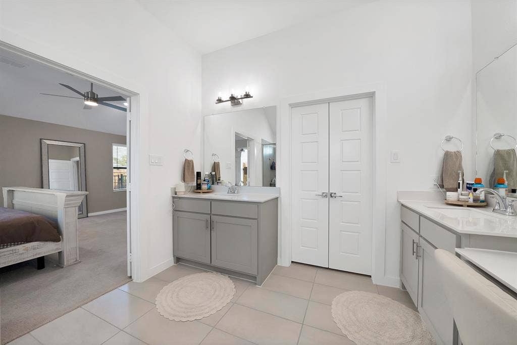3701 Turpin Drive, Princeton, TX 75071 Dual vanity with gray cabinetry and white countertops.