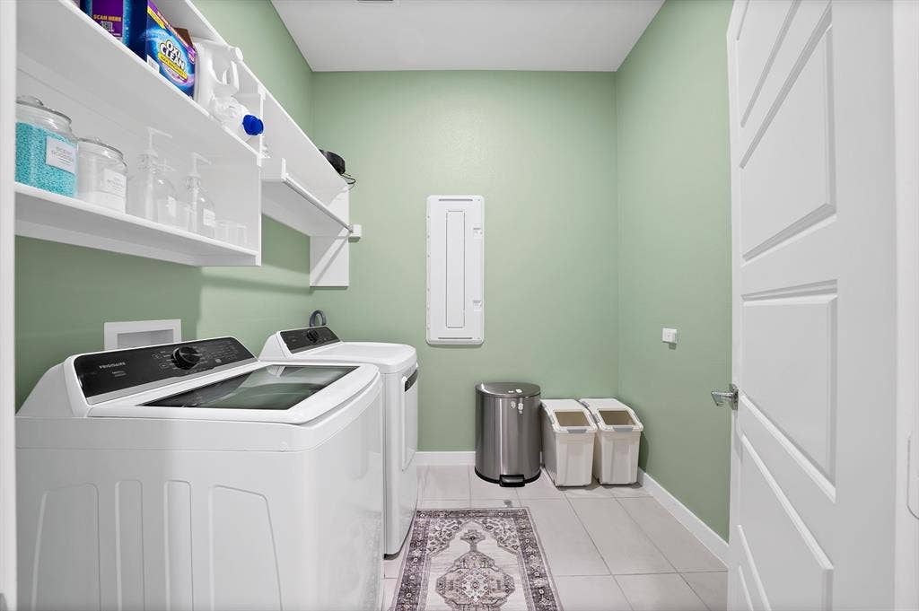 3701 Turpin Drive, Princeton, TX 75071 Laundry room with W/D hook ups, shelves and a drying rack.