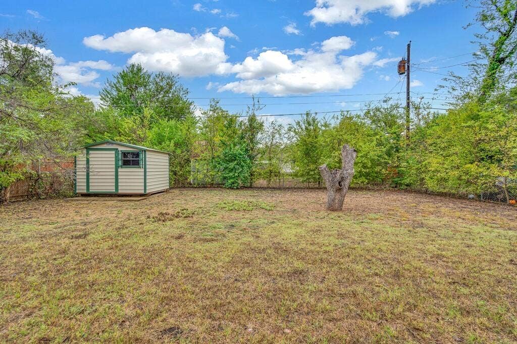 3720 Trice Avenue, Waco, TX 76707 Expansive yard with mature perimeter landscaping and a detached storage shed