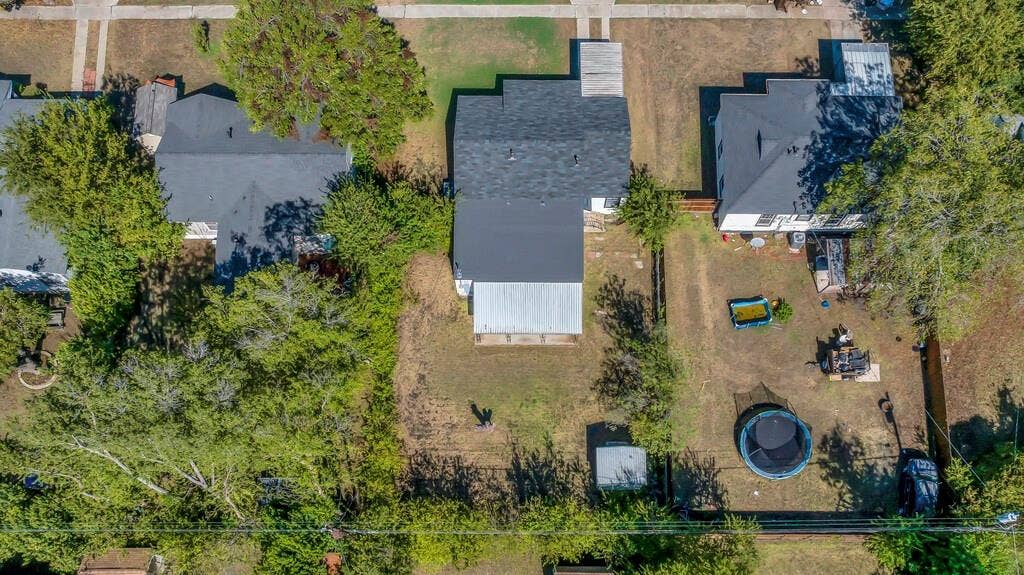 3720 Trice Avenue, Waco, TX 76707 Property featuring a dark shingle roof, a fenced backyard, and mature trees