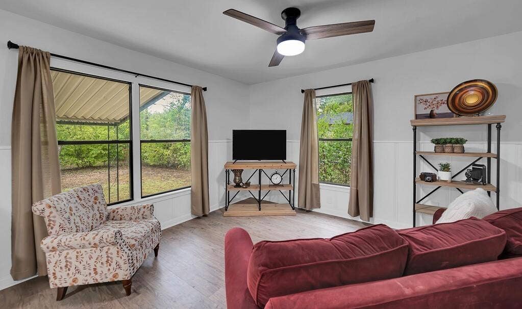 3720 Trice Avenue, Waco, TX 76707 Spacious interior with wood-finish flooring, white walls, and wainscoting