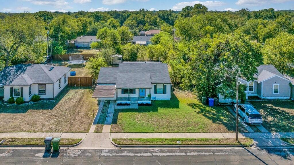3720 Trice Avenue, Waco, TX 76707 Single-story residence featuring a covered carport, paved driveway, and established front yard
