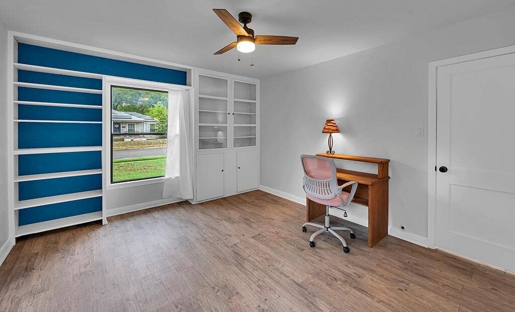 3720 Trice Avenue, Waco, TX 76707 Built-in shelving, built-in cabinetry, wood-finish flooring, ceiling fan, white paneled door