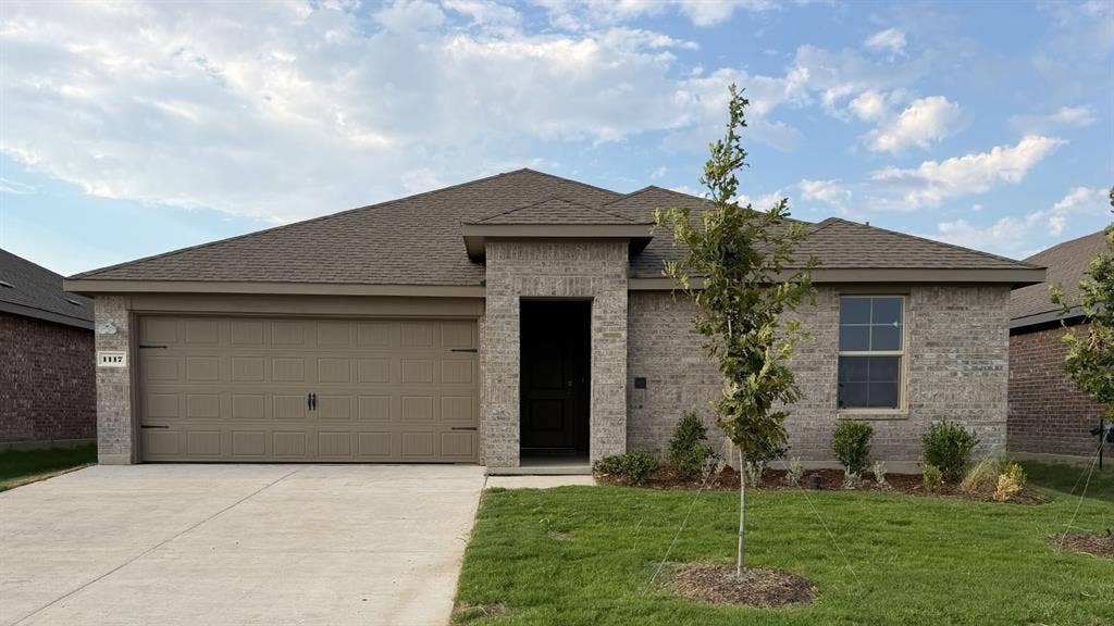 1117 Overhill Road, Josephine, TX 75135 Brick exterior with a gabled roof and attached two-car garage