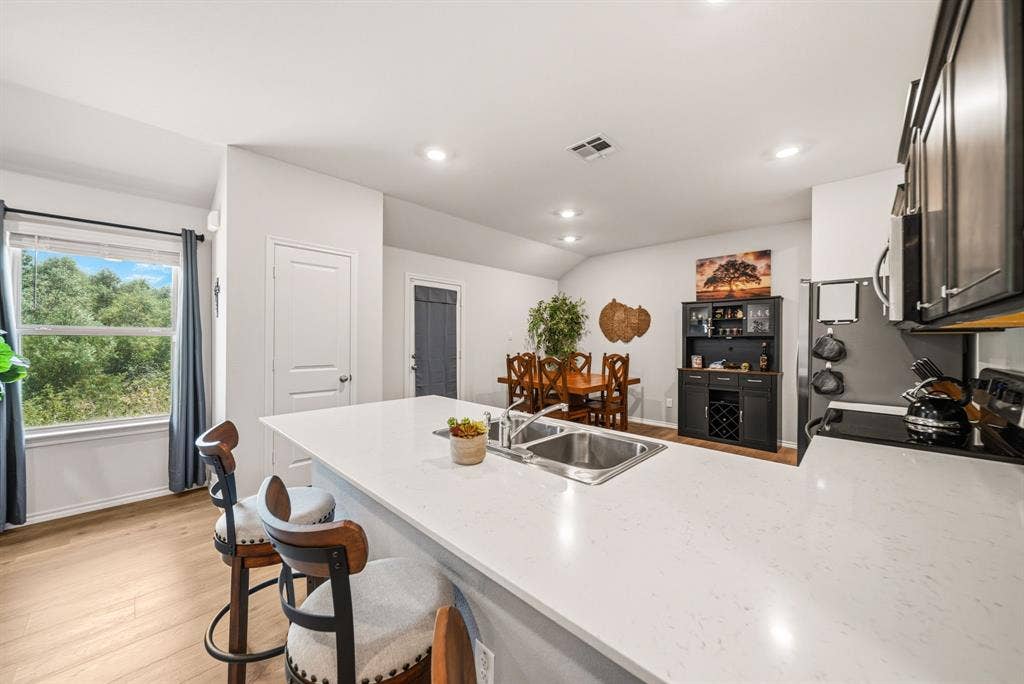 Kitchen island with an undermount double basin stainless steel sink