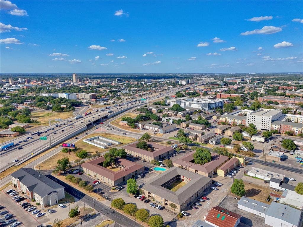 1214 Baylor Avenue, #109, Waco, TX 76706 Expansive urban landscape featuring multi-lane highways and commercial structures