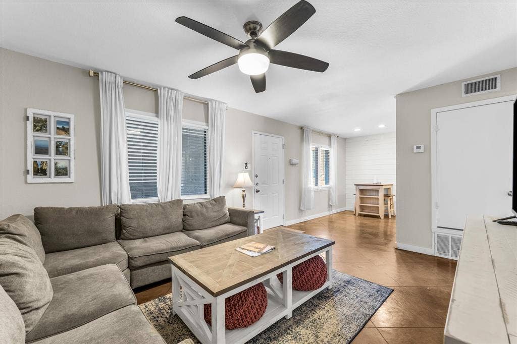 1214 Baylor Avenue, #109, Waco, TX 76706 Recessed lighting and a ceiling fan with integrated lighting illuminate the living space