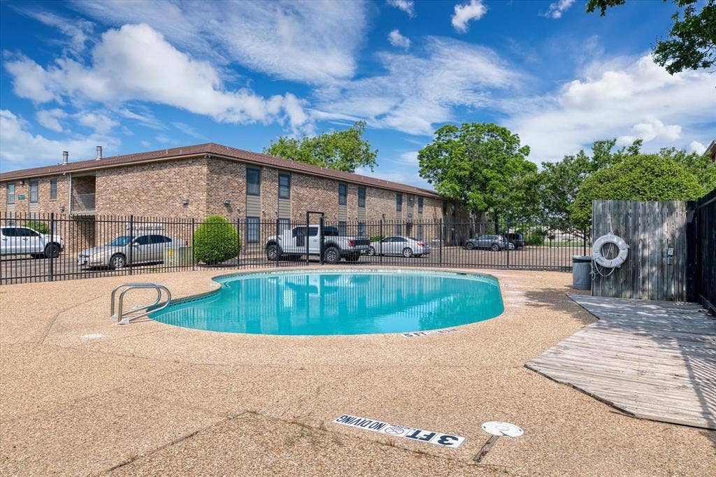 1214 Baylor Avenue, #109, Waco, TX 76706 Swimming pool with a textured aggregate deck and metal handrails