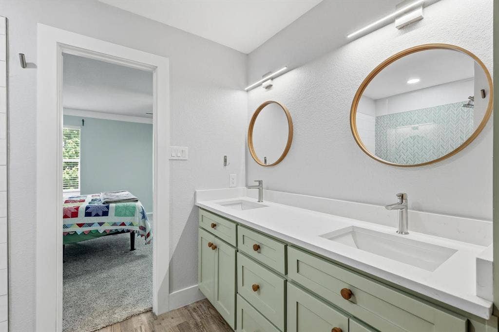 800 Poncho Lane, Fort Worth, TX 76052 Dual vanity with light green cabinetry, white countertops, and integrated rectangular sinks