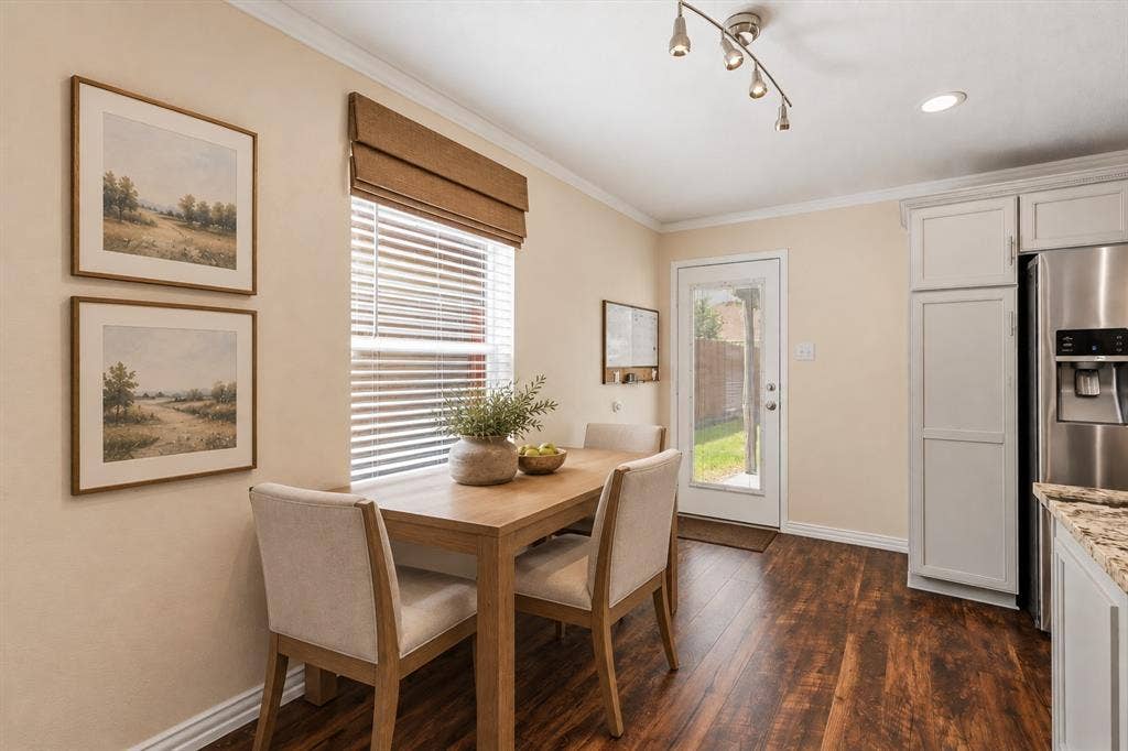 800 Poncho Lane, Fort Worth, TX 76052 Wood-finish flooring, white cabinetry, stainless steel refrigerator, granite-style countertop, and a glass-paned exterior door