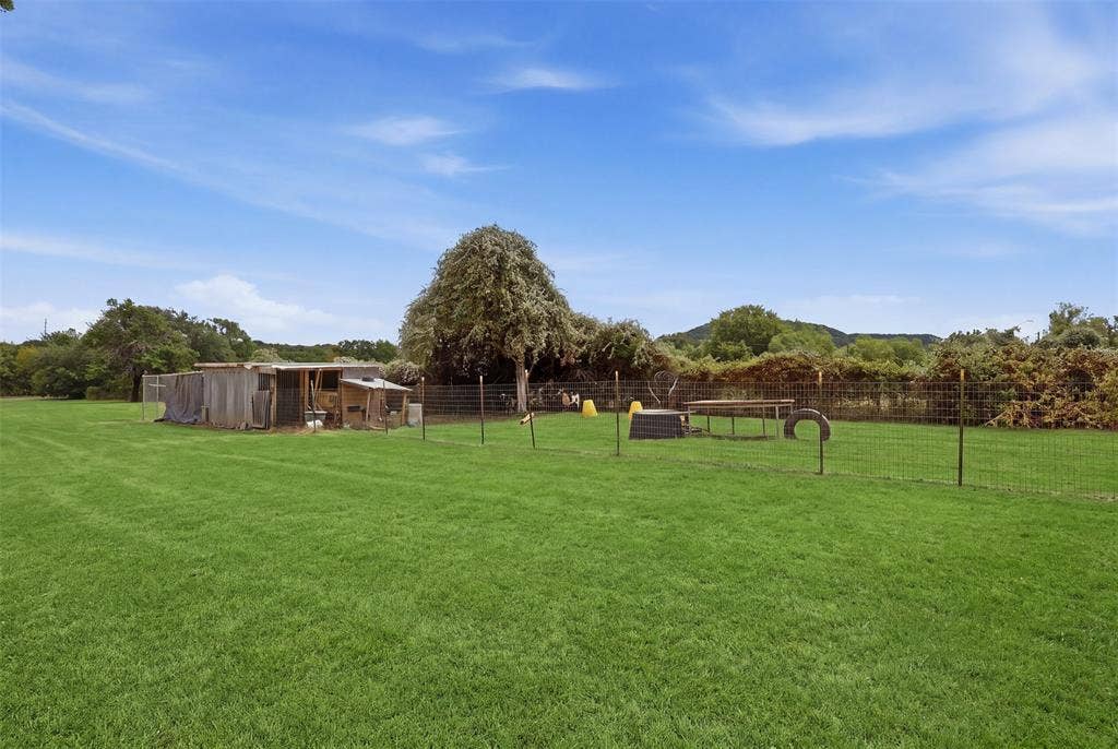 Grass has been digitally enhanced for visual presentation. Small livestock pens