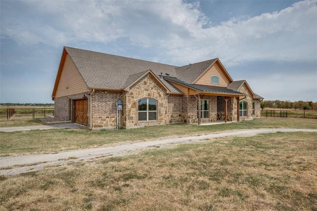 8400 Holder Road, Northlake, TX 76247 Stone and brick exterior with a covered front porch featuring wood posts