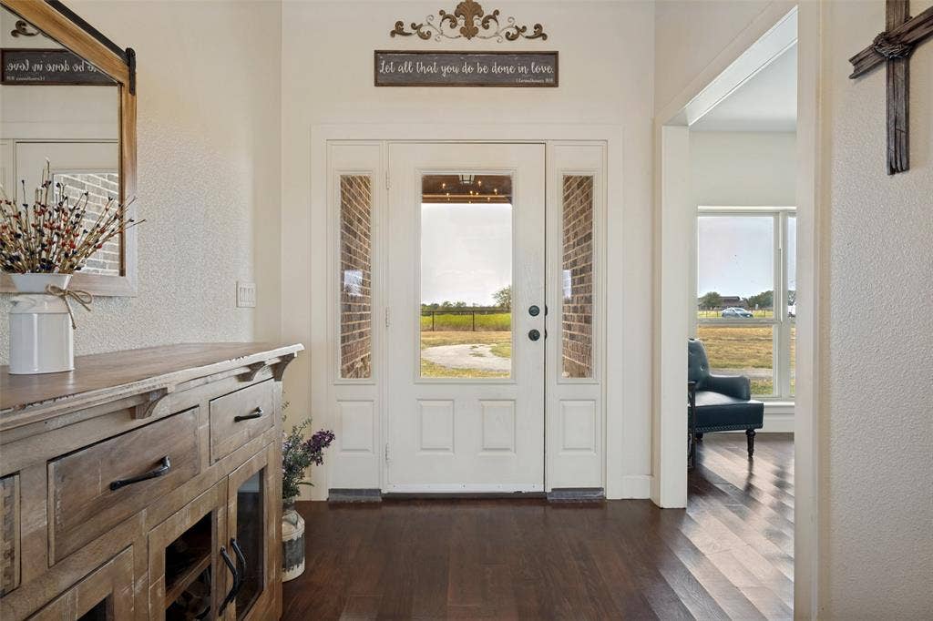 8400 Holder Road, Northlake, TX 76247 Double entry door with glass sidelights and transom, dark wood-finish flooring, and white painted trim