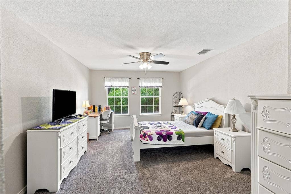 7416 Casper Drive, Plano, TX 75025 This room is very spacious, it can be a secondary primary bedroom, it has walk in closet, and a full bathroom next to the room