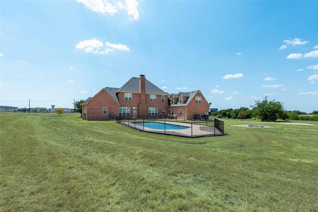 1122 County Road 1224, Celina, TX 75009 Rear photo of the home showing tons of wide open space ready to be developed.