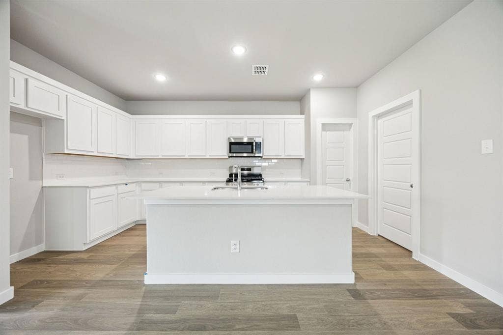 1939 Paddock Lane, Seagoville, TX 75159 Kitchen in the Hayden home plan by Trophy Signature Homes – REPRESENTATIVE PHOTO