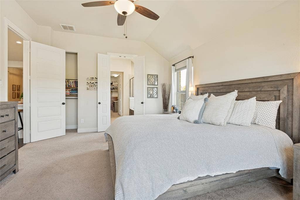 4601 Massey Meadows Way, Midlothian, TX 76065 Vaulted ceiling with a ceiling fan, recessed window with natural light, and paneled interior doors