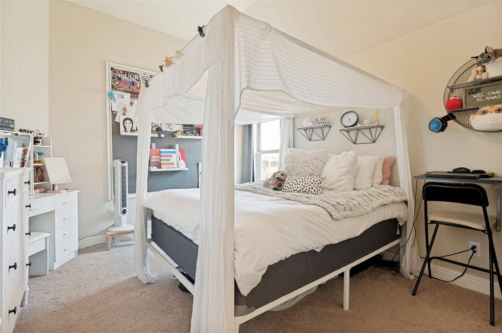 4601 Massey Meadows Way, Midlothian, TX 76065 Carpeted bedroom featuring a window, built-in shelving, and a wall-mounted desk