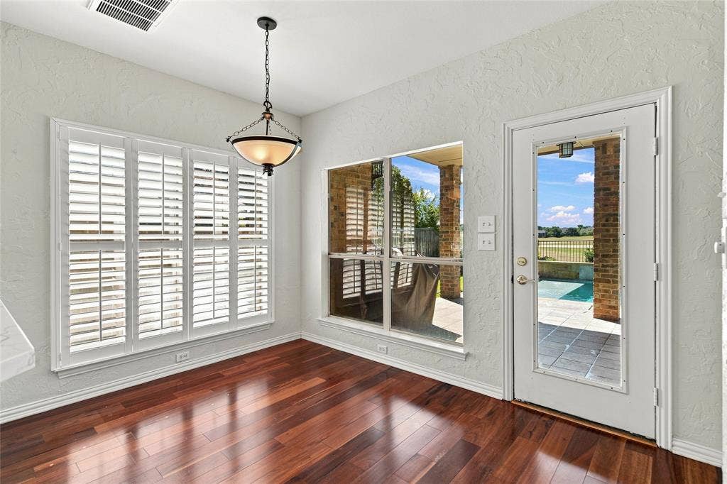 1820 Forest Bend Lane, Keller, TX 76248 Dining area with backyard views of pool and golf course.