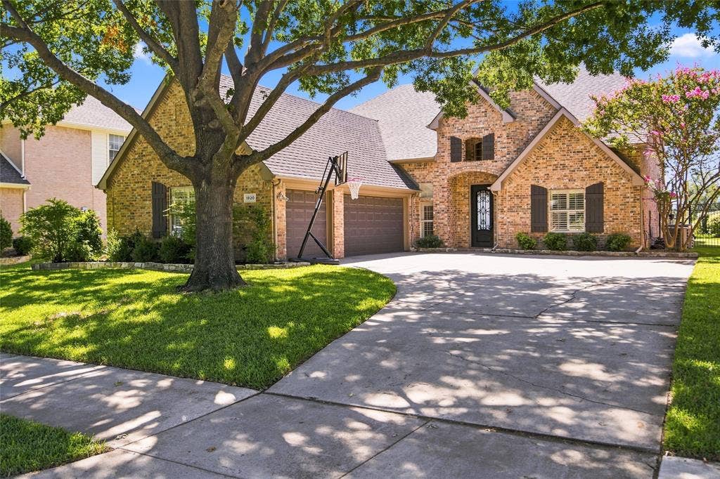 1820 Forest Bend Lane, Keller, TX 76248 Brick exterior with multiple gables, arched entry, and dark wood shutters