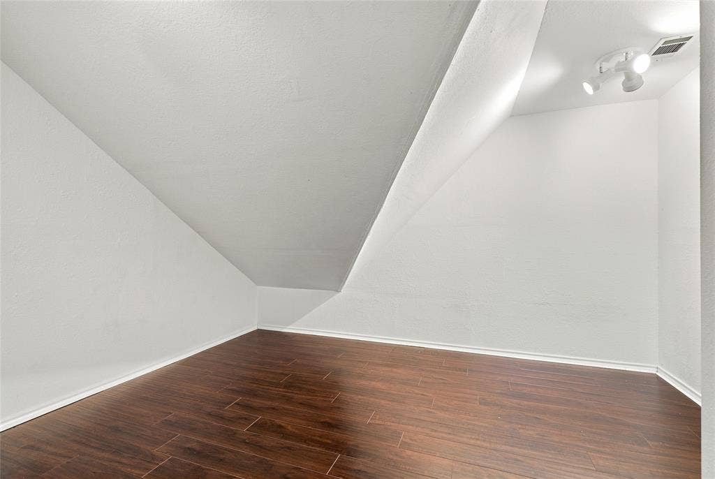1820 Forest Bend Lane, Keller, TX 76248 Finished bonus room with white wall finishes, lighting, and ventilation.