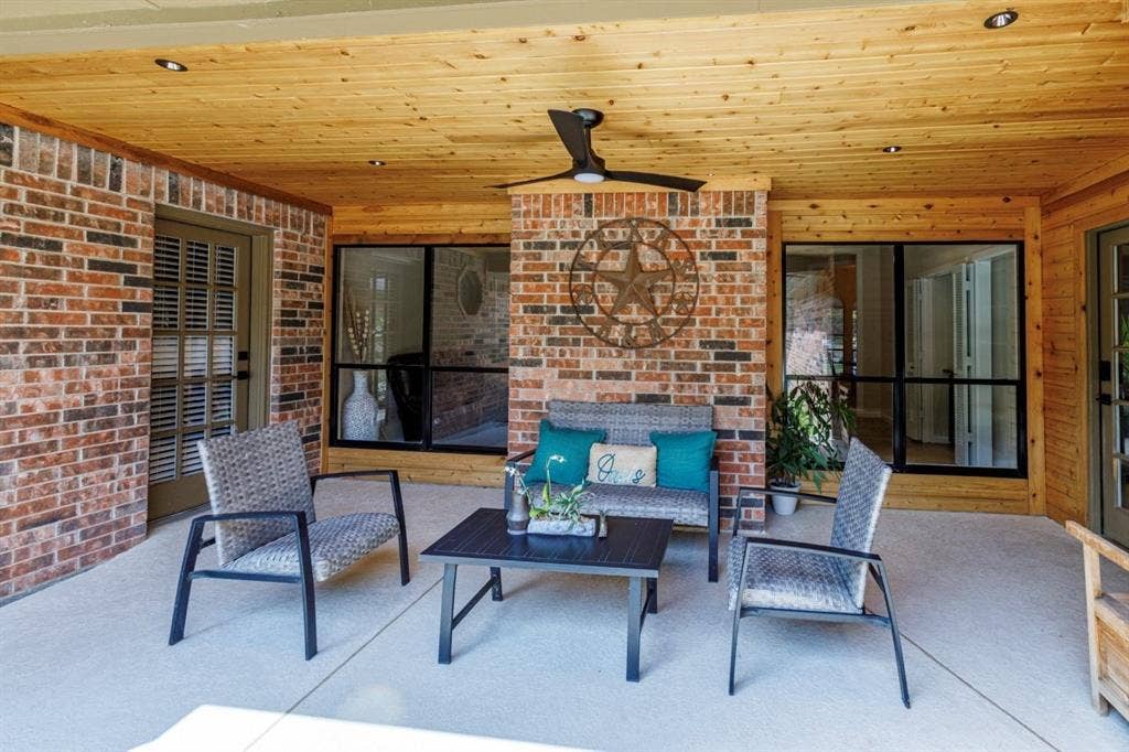 1408 Quapaw Trail, Mesquite, TX 75149 Covered patio featuring brick masonry, wood-paneled ceiling, recessed lighting, and a ceiling fan